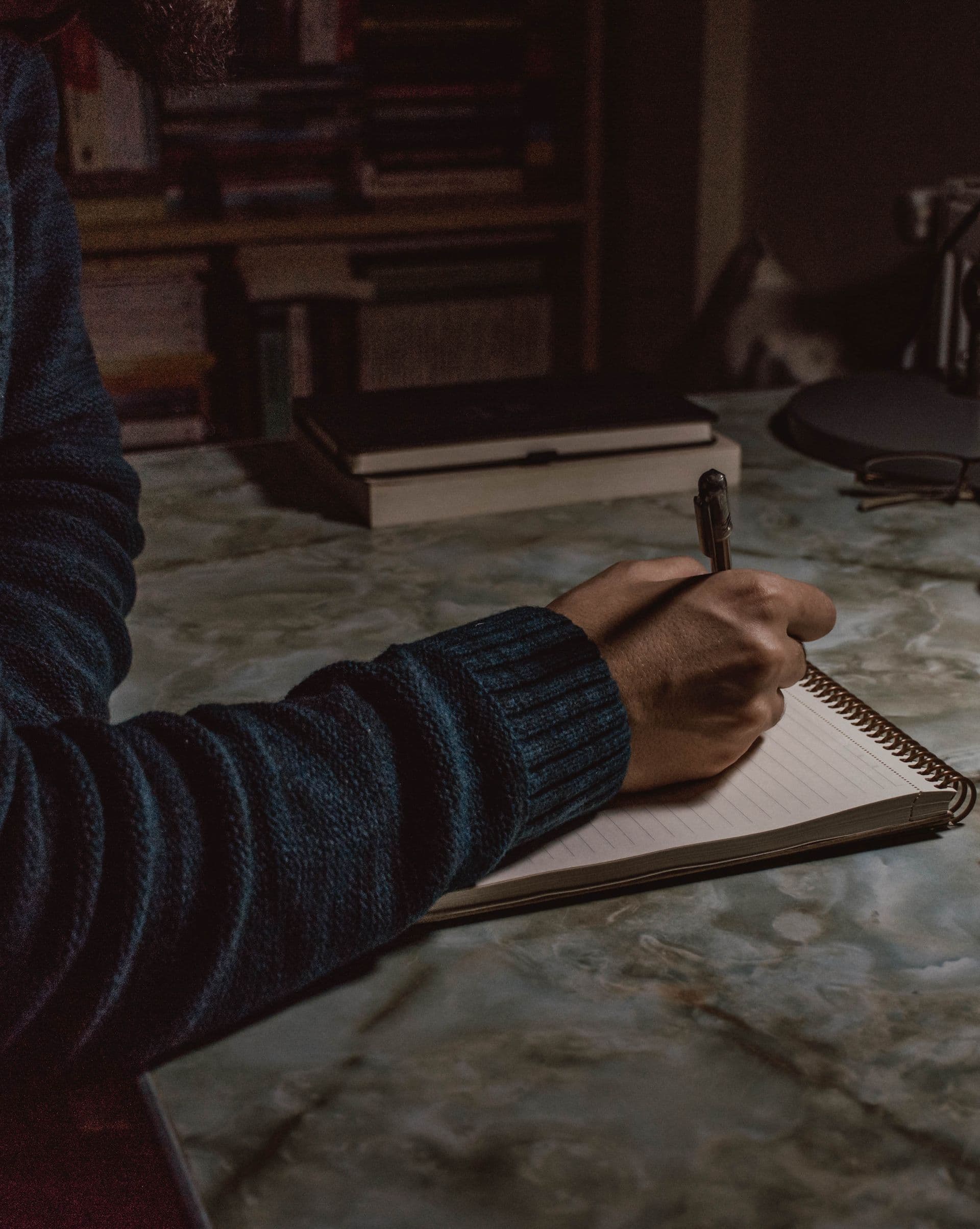 Handwritten notes being taken at a desk